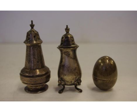 Three English sterling silver pepperettes including an egg shaped with weighted bottom hallmarked London 1888 (William Hutton