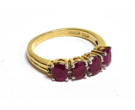 A MODERN 9CT GOLD, RUBY AND DIAMOND DRESS RING the four pinkish-red oval mixed-cut rubies, with pairs of tiny eight-cut diamo