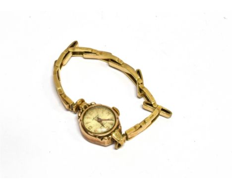 ACCURIST, A LADY'S 9CT GOLD ROUND BRACELET WATCH, CIRCA 1951 the round silvered dial with raised gilt Arabic quarters and arr