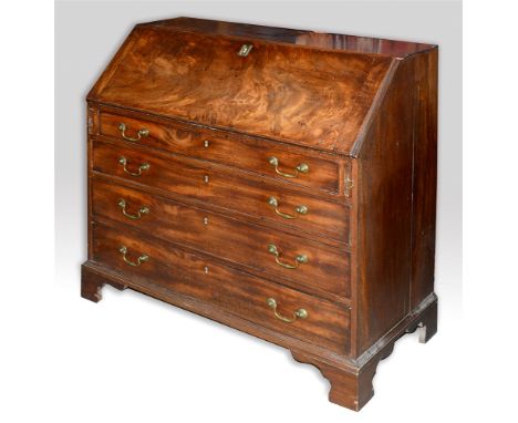 A GEORGE III MAHOGANY BUREAU  the interior fitted with drawers and pigeonholes, above four long graduated drawers on bracket 