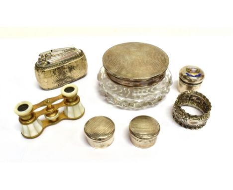 A COLLECTION OF SILVER DRESSING TABLE JARS AND OTHER ITEMS  comprising; a silver mounted clear cut-glass powder jar, the engi