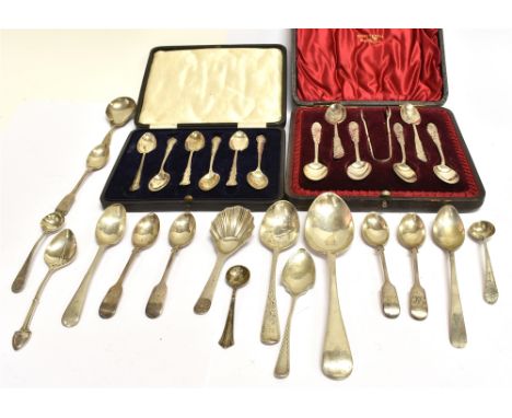 A COLLECTION OF SILVER SMALL FLATWARE, INCLUDING A SET OF SIX FLORAL HANDLES COFFEE SPOONS AND A TONGS,  in a fitted red-silk