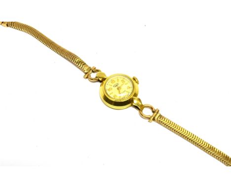 ROTARY, A LADY'S SWISS 18CT GOLD WRIST WATCH, ON A 9CT GOLD BRACELET the cream dial with alternate raised gilt baton and Arab