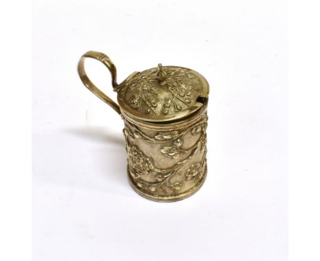 A CHINESE EXPORT CYLINDRICAL MUSTARD POT  With a scroll handle and a hinged cover with a small finial, overall embossed with 