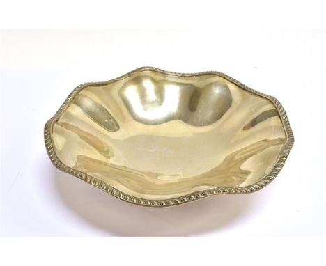 A SILVER GADROONED FRUIT BOWL with a wavy gadrooned border on a plain bracket foot, mark of Walker &amp; Hall, Sheffield 1909