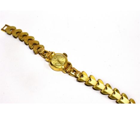 CORTEBERT, A LADY'S SWISS 18CT GOLD ROUND WRIST WATCH ON A GOLD-PLATED BRACELET round bushed-silvered dial with raised gilt b