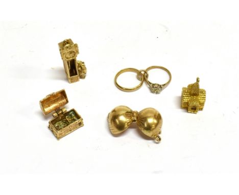 A GROUP OF FIVE 9CT GOLD CHARMS INCLUDING A CHURCH  comprising; an apple opening to reveal Adam &amp; Eve; an engagement ring