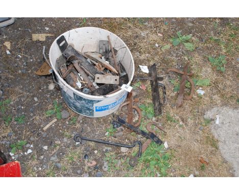 A bucket of metal and iron door and gate latches, etc. 