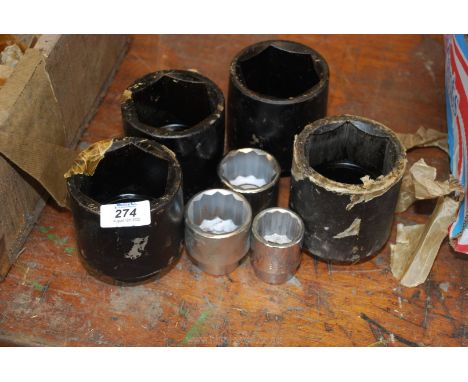 Three large impact sockets 1" drive, 2⅝" and one larger, some have Snap-on marks and broad arrow and 1948, plus three Bedford