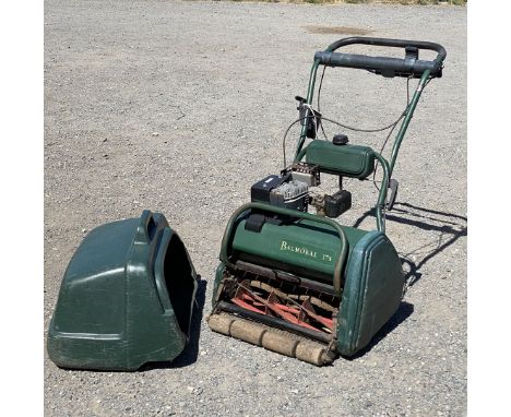 An Atco Balmoral 17s self propelled Petrol Cylinder Lawnmower with grass box and rear roller.