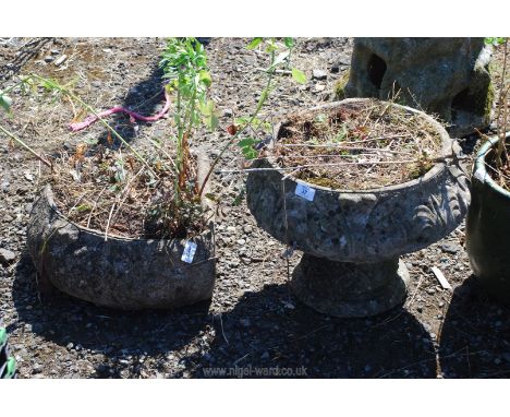 Two concrete planters, an urn 12" diameter x 13" tall and a corner planter 16" diameter x 7" tall.