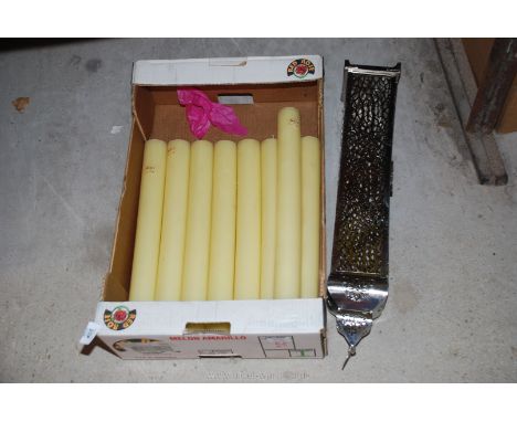 A box of church candles and a lantern. 
