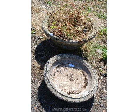 A round concrete planter 9" tall x 19" diameter and concrete bird bath top 16" diameter. 