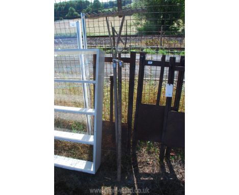 A vintage wooden hay rake and pitch fork. 