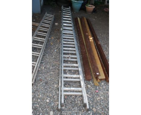 A seventeen rung double extension aluminium ladder.