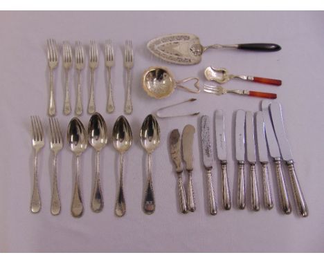 A quantity of silver and white metal flatware to include a fish slice and a caddy spoon
