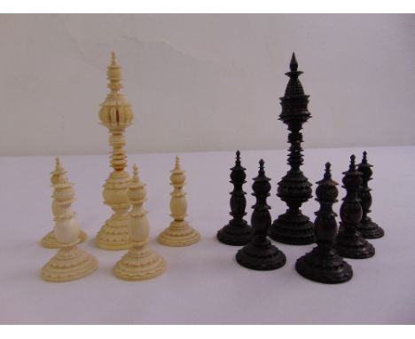 Eleven 19th century carved hardwood and ivory chess pieces