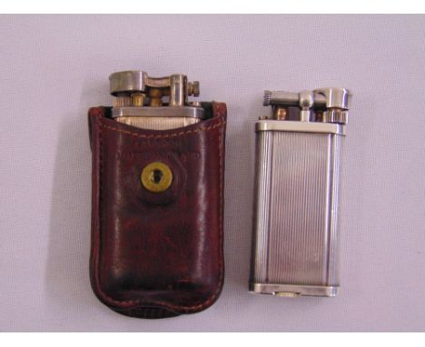 Two vintage Dunhill lighters with engine turned finish the other in original leather case (2)
