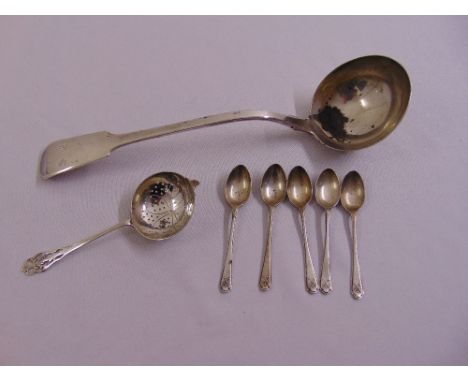 A quantity of silver to include a George IV fiddle pattern silver soup ladle, London 1824, a silver tea strainer and five sil