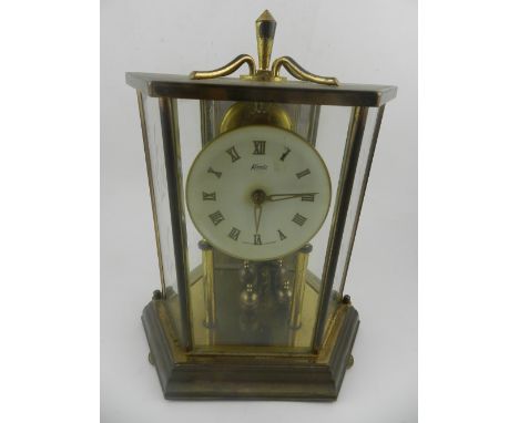 An anniversary mantel timepiece, having woven enamel dial with set cylinder movement. signed Kundo,. H.23cm.
