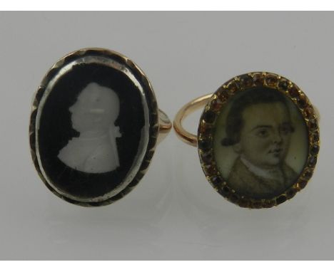 A 19th century yellow gold portrait ring, centred with a miniature head and shoulder portrait of a young gentleman on ivory, 