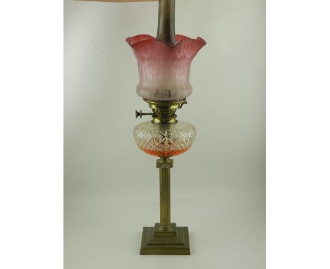 A Victorian brass oil lamp.