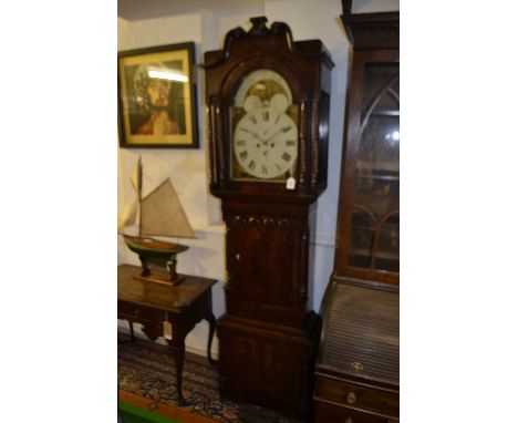 An early Victorian mahogany longcase clock, the case with broken swan neck pediment above spiral carved pilasters and columns