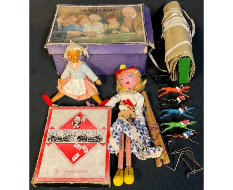 A Chad Valley Escalado game, cold painted lead horses, boxed; an early Monopoly game; a Pelham puppet; a wooden doll 