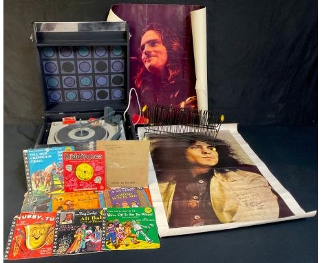 A 1960s Dansette portable stereo record player; a 1960s wire wrapped 45 rpm record stand; record player needles; children's 4