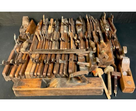 Carpentry Tools - a quantity of 19th century and later wooden moulding planes, various sizes, approximately 60; others includ
