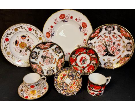 A Royal Crown Derby Imari palette Peony pattern coffee can and saucer, first quality; an A.962 pattern coffee can and saucer,