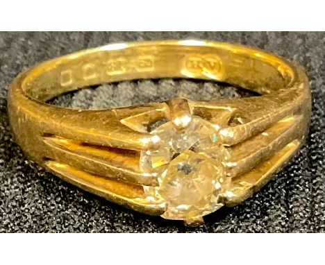 An 18ct gold diamond solitaire gypsy ring, oval cut, slight citrus tinge, approx 0.5ct, size O/P, 5g 