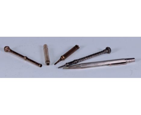 Pens - a 19th century silver coloured metal propelling pencil, wrthen-fluted, the terminal set with a hardstone, 10.5cm long;