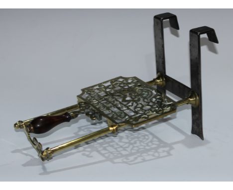 Masonic and Friendly Society Interest - a 19th century brass and steel trivet, the adjustable plateau pierced with square and