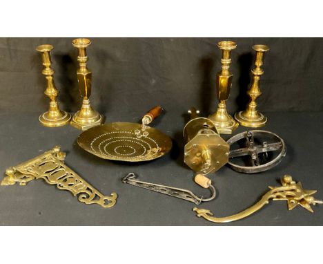 A 19th century meat jack; a brass skillet; a pair of ejector candlesticks; a Boer War brass bracket depicting Robert, Baden-P
