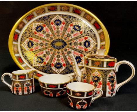 A Royal Crown Derby Imari palette 1128 pattern miniature tea set on tray, comprising teapot, milk jug, sugar bowl, teacup and