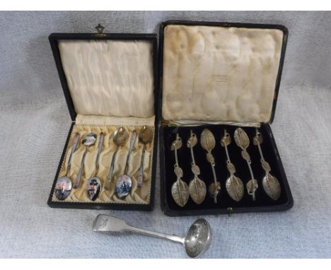 A CASED SET OF SIX SILVER GILT ENAMELLED TEA SPOONS, each enamelled in pinks, purples and blacks with sunset scenes, a cased 