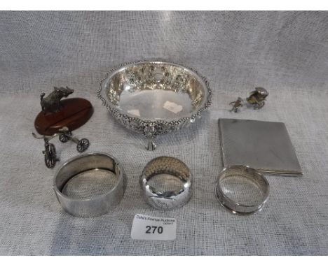 A HALLMARKED SILVER FLORAL REPOUSSE DISH on four lion-mask and paw feet and a collection of other small silverwares