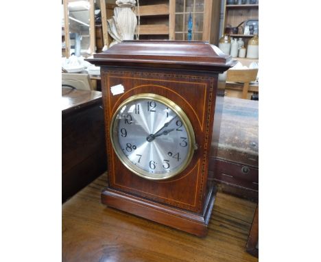 AN EDWARDIAN MAHOGANY CASED MANTEL CLOCK with a Jerome movement