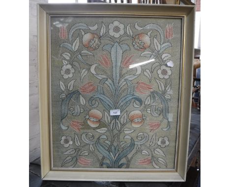 AN ARTS AND CRAFTS STYLE NEEDLEWORK PANEL decorated with flowers and leaves in a painted and gilt frame