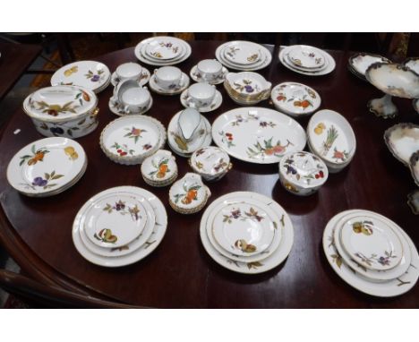 A ROYAL WORCESTER 'EVESHAM' DINNER SERVICE complete for six, with extra plates, serving dishes and other items