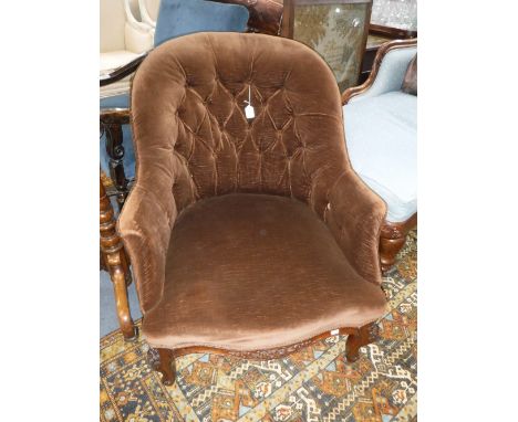A VICTORIAN WALNUT BUTTON-BACK ARMCHAIR