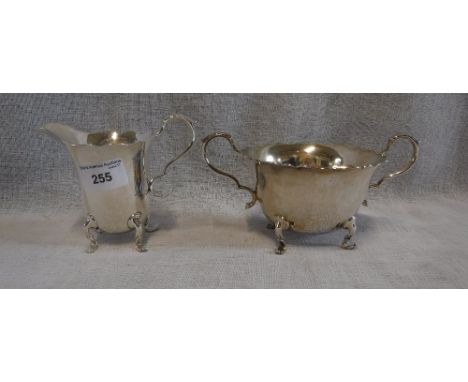 A SHEFFIELD SILVER TWO-HANDLED SUCRIER by Walker & Hall and a cream jug ensuite (2)