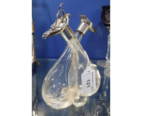 A SILVER MOUNTED OIL AND VINEGAR BOTTLE of conjoined form