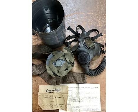WW2 Belgium Army Gas Respirator in steel carrying canister with shoulder strap and original instructions. The canister has th