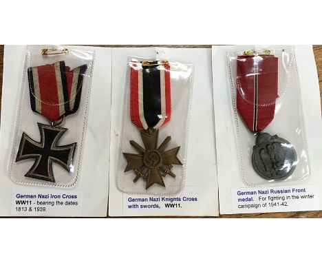 German Army Replacement/Reproduction, Iron Cross, Knights Cross with Swords and a Russian Front medal.