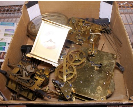 CLOCK MOVEMENTS. Box of antique clock movements and related parts 