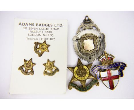 SILVER FOB. Enamel badges and a silver fob