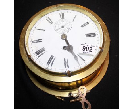 SHIPS CLOCK. Brass ships clock with enamel face and secondary dial, working at lotting up, D: 26 cm