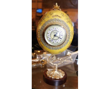 OSTRICH EGG CLOCK. Ostrich egg clock on gilt stand